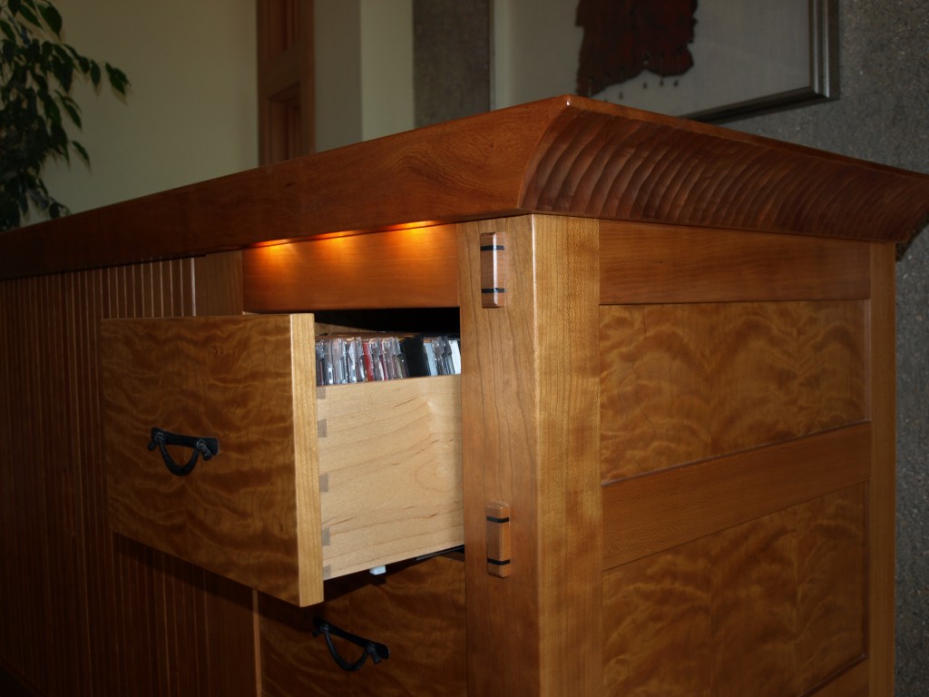 Automatic CD drawer lighting and ebony wedged through mortices