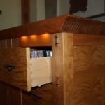 Automatic CD drawer lighting and ebony wedged through mortices